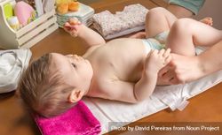 Hands Of Parent Changing Diaper Of Baby Free Photo 0yW3q4 Noun