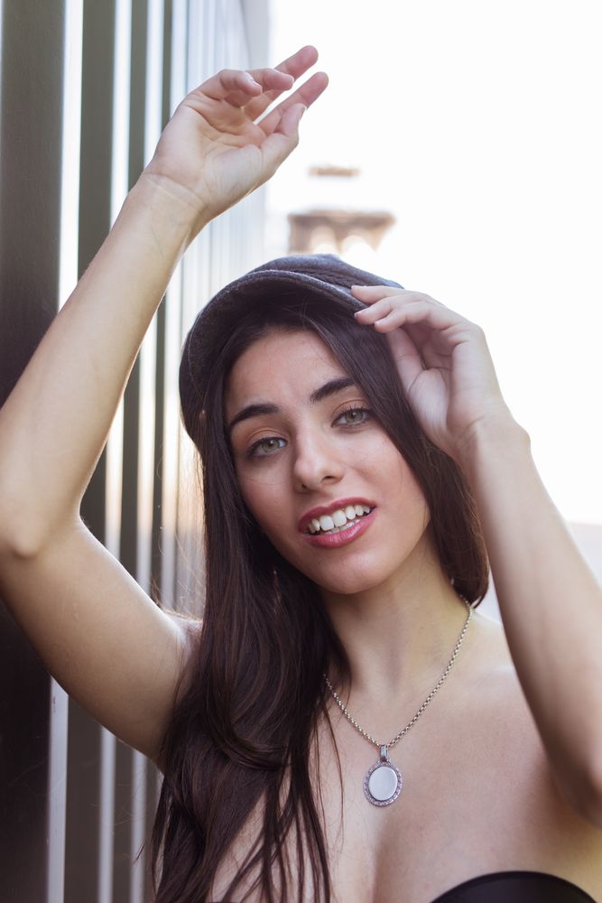 Charming Hispanic lady in hat