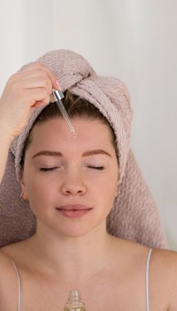 Serum application on forehead.
