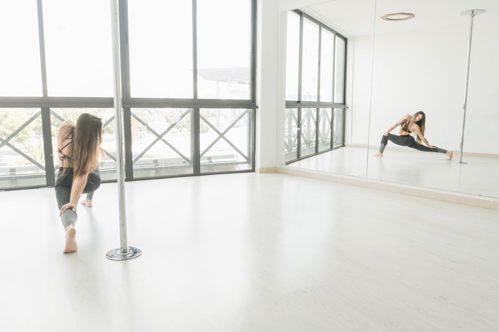 Flexible female stretching in studio