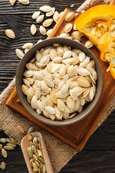 Cooking ingredients for fall season - pumpkin seeds, pumpkin