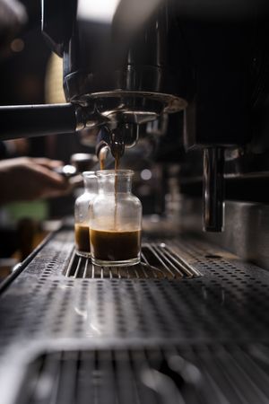 Barista using coffee machine