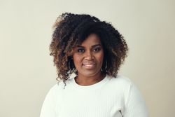 Close up studio portrait of content Black woman