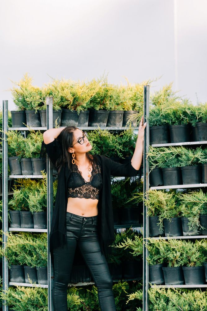 young female in greenhouse