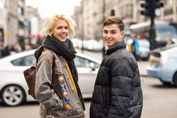 Man and woman smiling in UK street