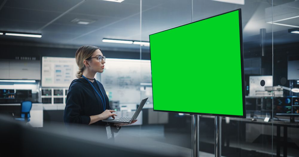 Lead Software Engineer Standing Alone in a Meeting Room