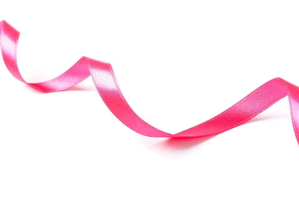 Pink ribbon isolated on plain background. Gift concept
