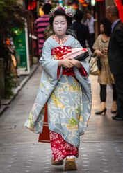 Japan - May, 10 2013: Geisha walking on city street