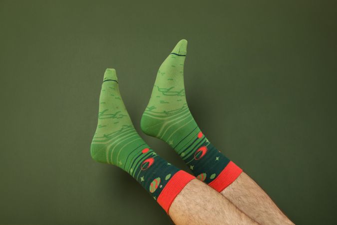 Colored socks with a print on men's feet.