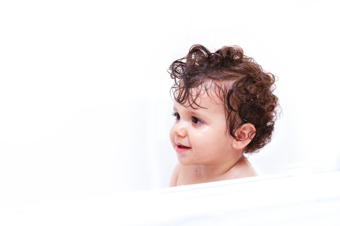Funny baby taking a bath