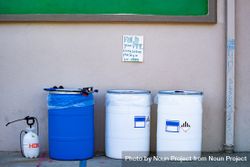 Three biohazard bins for PPE at public  COVID-19 test site 0WO1p0