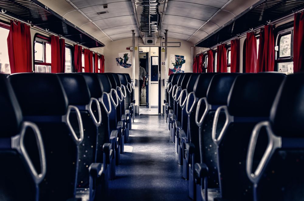 Blue seats in train during daytime