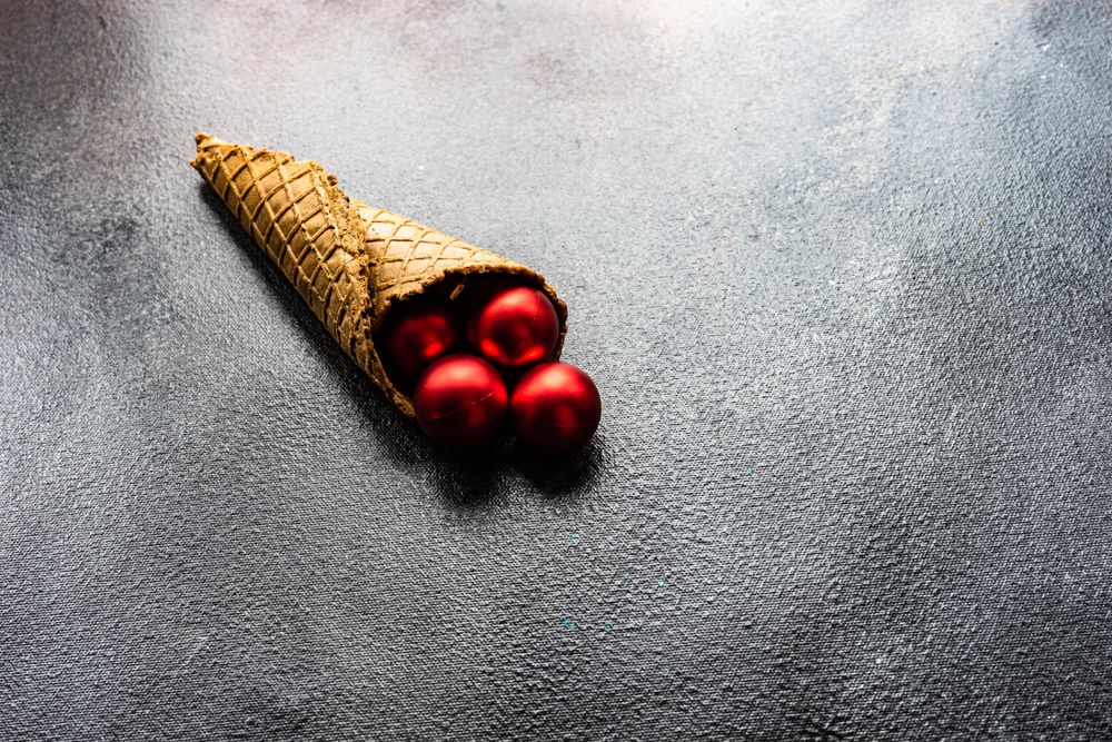 Christmas concept of cone with red baubles