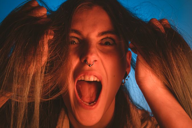 woman touching her hair