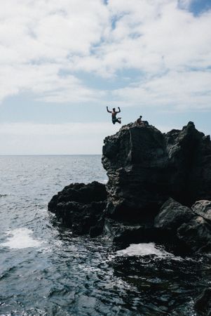 Person cliff jumping in Lanzarote