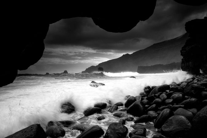 Amazing stone shore and pink sky with clouds