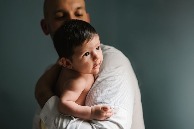 Father hugging cute baby