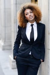 Female in suit leaning outside
