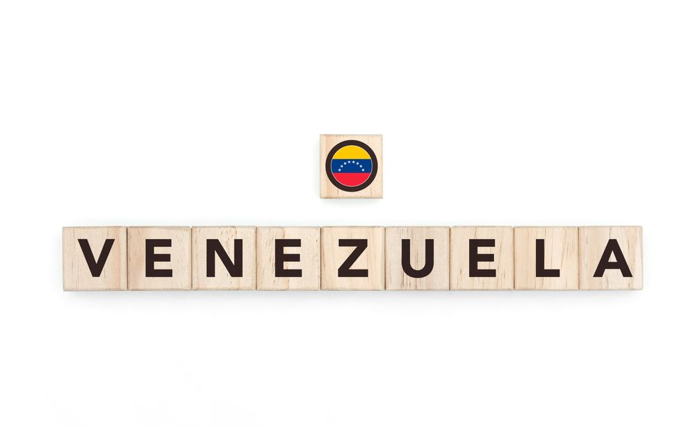 Wooden blocks bearing the name and flag of Venezuela. Latin and South American Culture, national identity, travel, and geography in a copy space design.