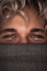 Young man's happy blue eyes