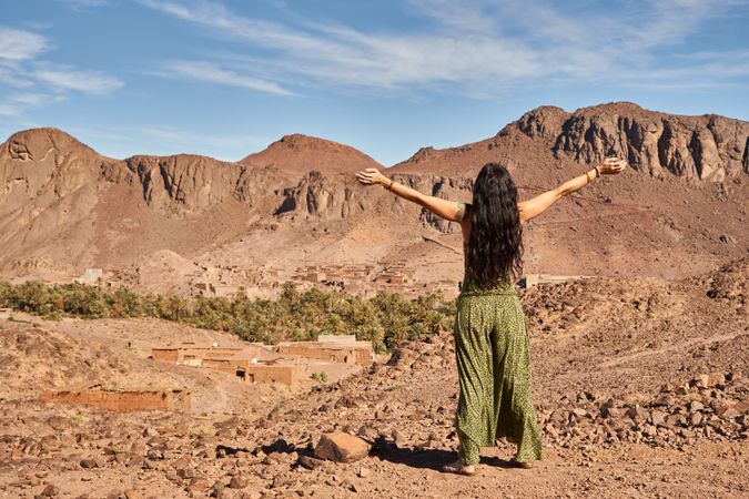 Woman between desert near mountains