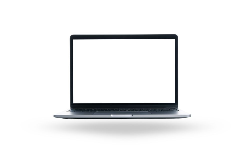 A sleek laptop with an open, blank screen awaits tasks