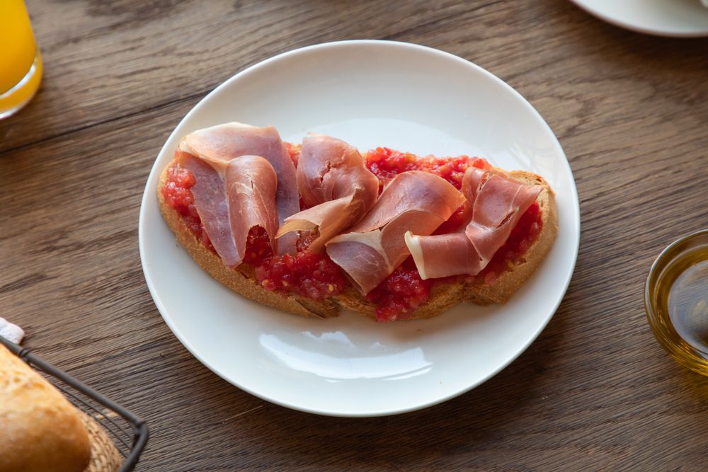 Stylish serving dishes with sandwich for breakfast
