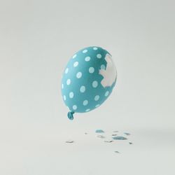 Polka dot blue Easter egg balloon on bright light background