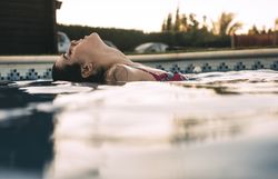 Side view of woman in pool