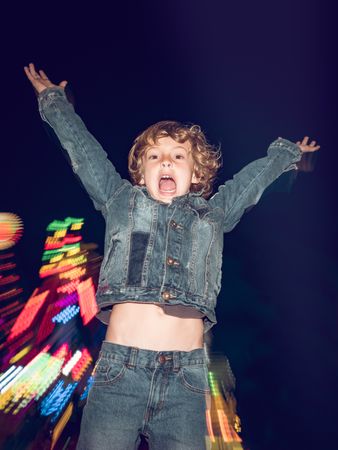Playful boy in amusement park