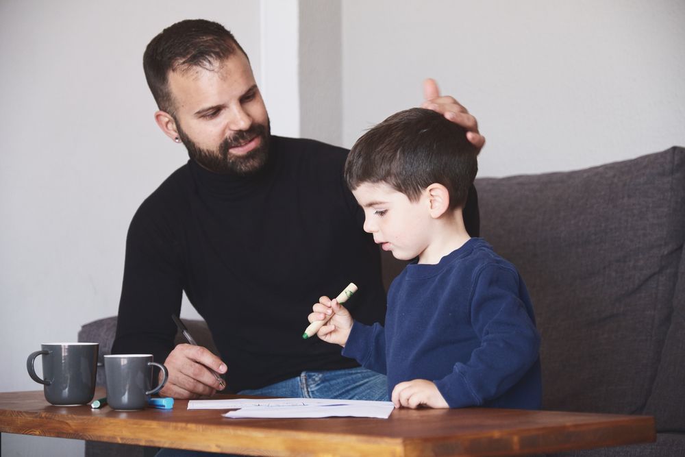 Father and son drawing together