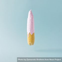 Corn with pink syrup on pastel blue background 5pvq8b