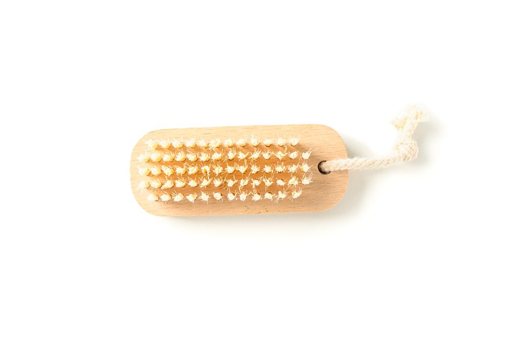 Wooden bath brush isolated on blank background