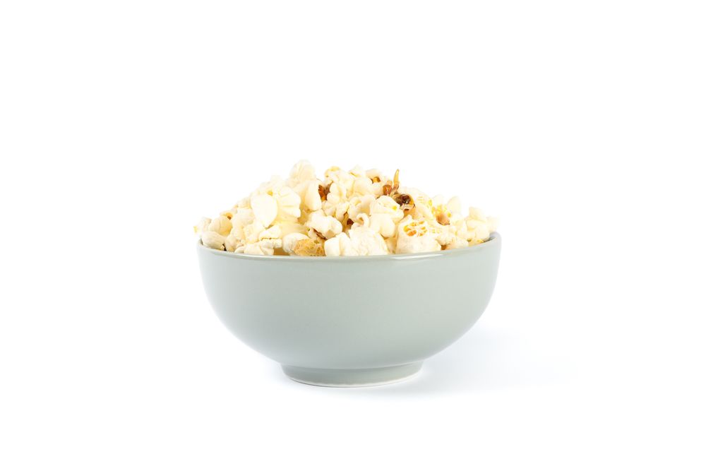Bowl with popcorn isolated on blank background
