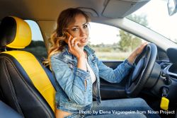 Female talking on cell phone in vehicle 0V32D5