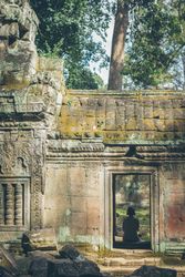 Anonymous woman in arch of old temple