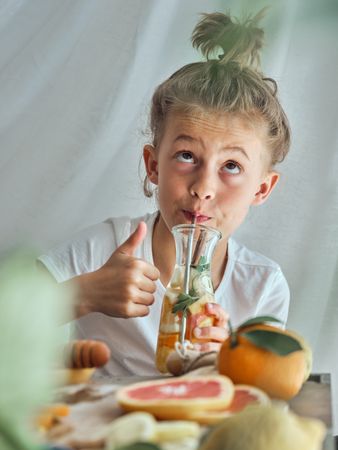 Boy drinking water with fruits