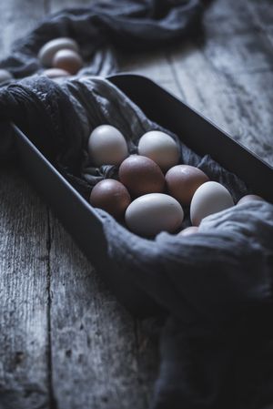 Raw eggs on tablecloth
