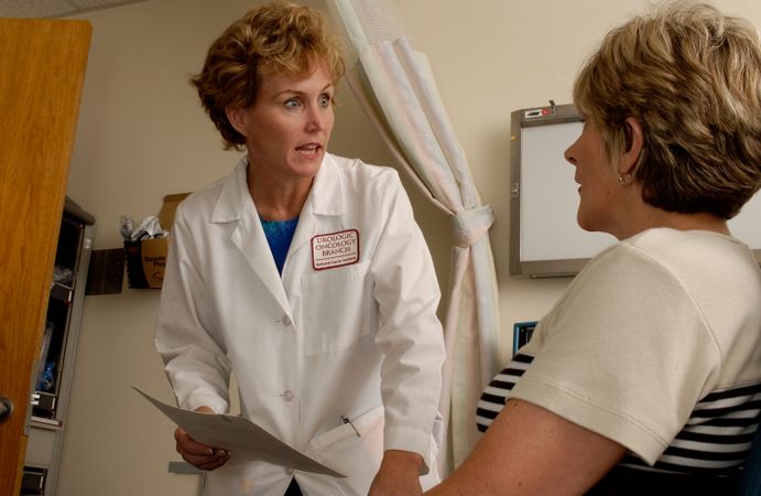Bethesda, MD - USA, 2006: A female doctor talks with a female patient