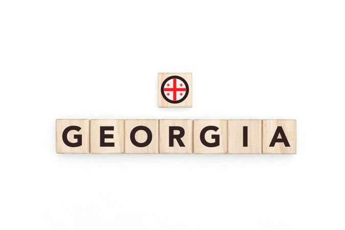 Wooden blocks bearing the name and flag of Georgia.