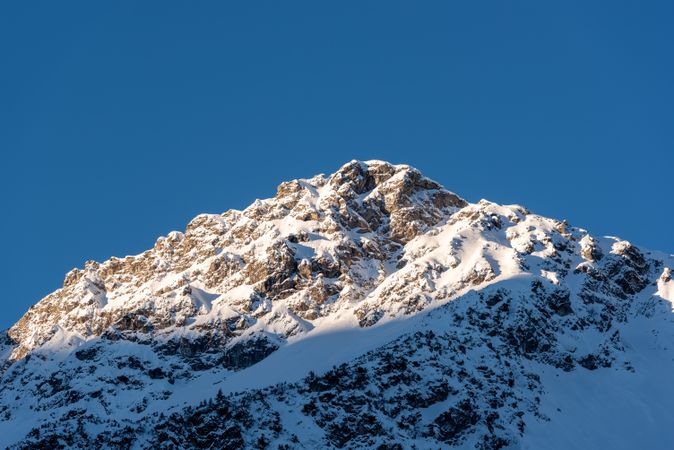 Mountain peak in the Bavarian Alps covered in snow on a sunny day in December