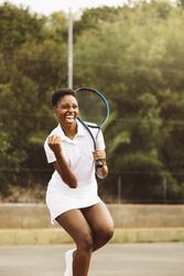 Woman celebrating a point during a tennis match