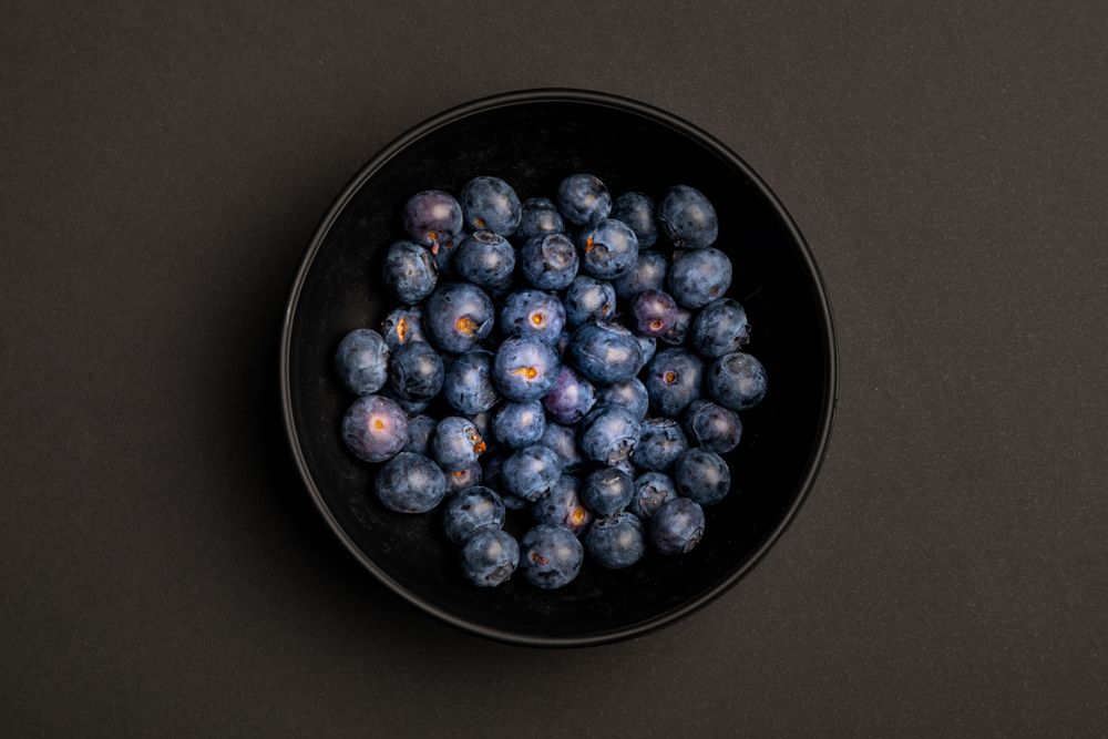 Bowl with ripe blueberries