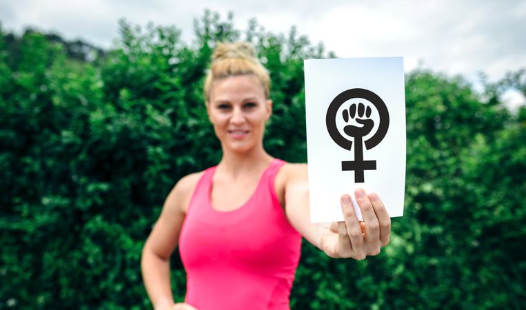 Woman showing symbol of feminism