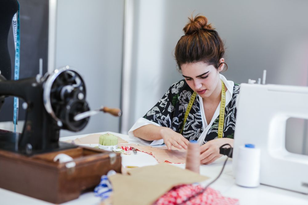 Woman in a sewing school
