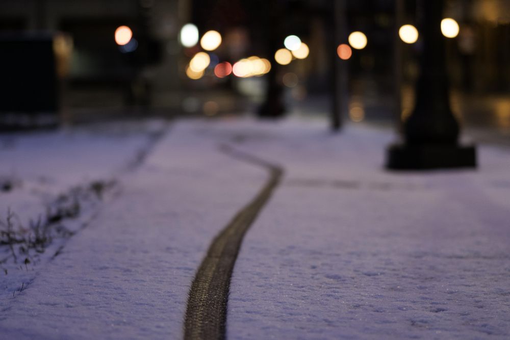 A bike tire track in the snow