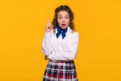 Girl with raised finger, surprised expression