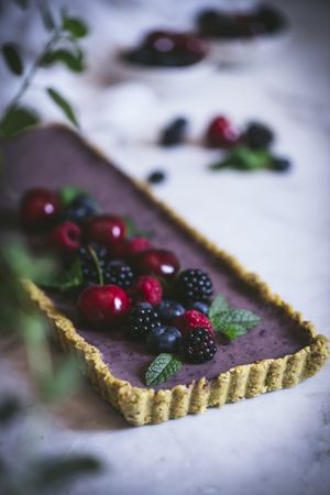 Fresh blueberry pistachio cake with whole berries on top