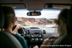 Two women in a car near rocky mountains 5lWEo0
