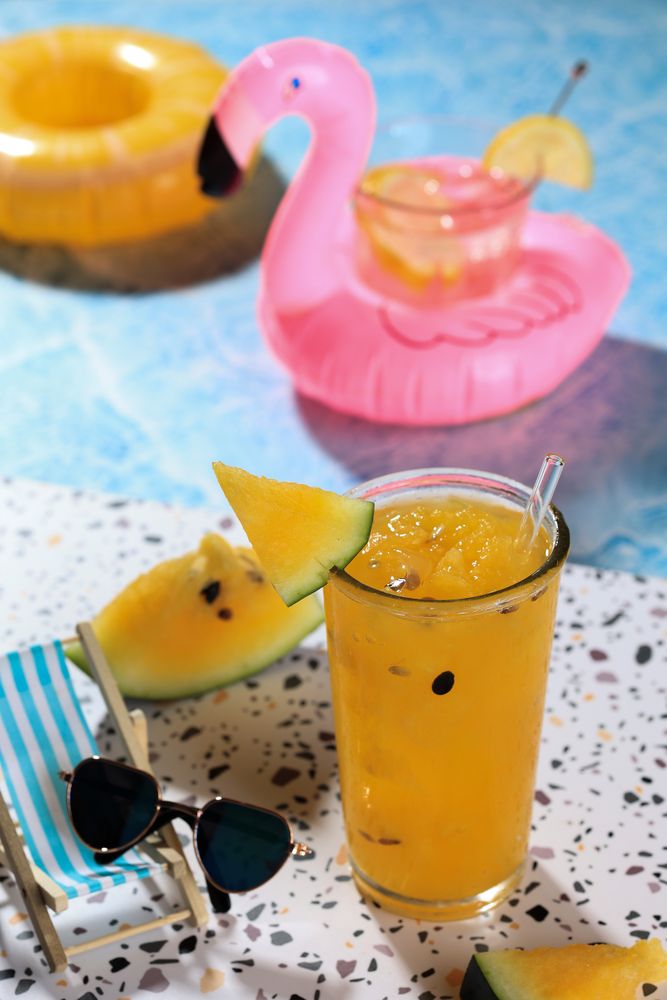 Yellow Watermelon Juice Beside teh Pool